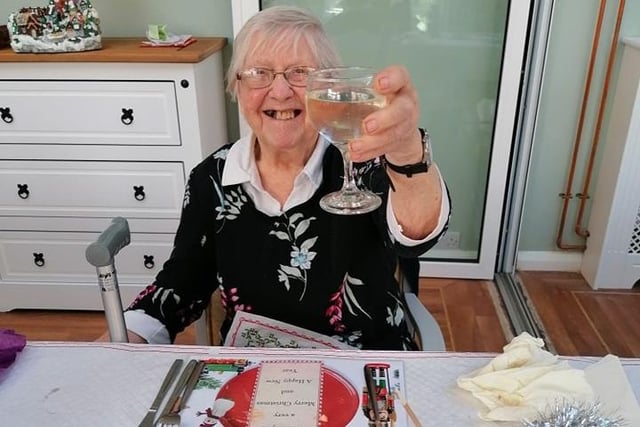 Cheers! Joan Tranberg enjoying the celebrations.