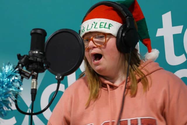 One of the individuals supported by Home From Home Care recording lyrics for Perfect Christmas