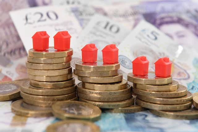 EMBARGOED TO 2230 TUESDAY DECEMBER 13 File photo dated 12/09/18 of models houses on a pile of coins and bank notes, as the leader of the Liberal Democrats has urged the Government to ban home repossessions over Christmas, as he warned of a looming "mortgage nightmare" due to soaring monthly payments.