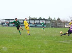 Joe Smith fires home Sleaford's second goal in the rain on Saturday. Photo: Steve W Davies Photography.