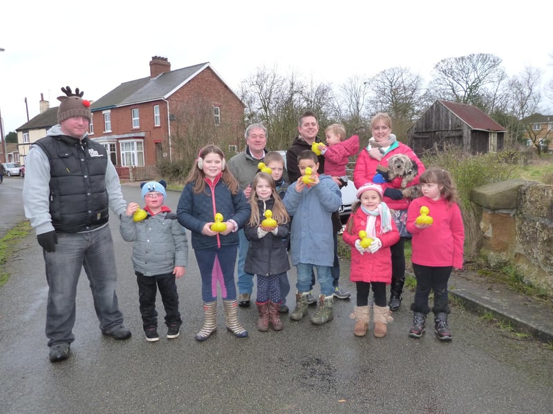 A scene from Market Rasen's annual New Year's Day duck race of 2015. Some 1,300 yellow ducks made their way down the River Rase, from Parry’s Bridge to the finish line as part of the event. First past the post and the winner of £100 was number 893, ‘Hollie’ owned by Hollie Appleyard. Organiser Colin Pitman (back, left) is pictured with some of the attendees.