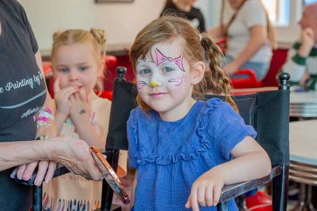 Amelie Steadman gets her face painted. Photo: John Aron