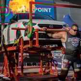 Giving a lift to a car ... Dean Mason, of Boston, in the UK's Strongest Man 2025 contest.