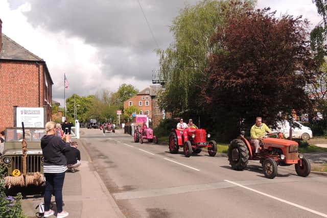The enormous procession of tractors and other vintage vehicles.