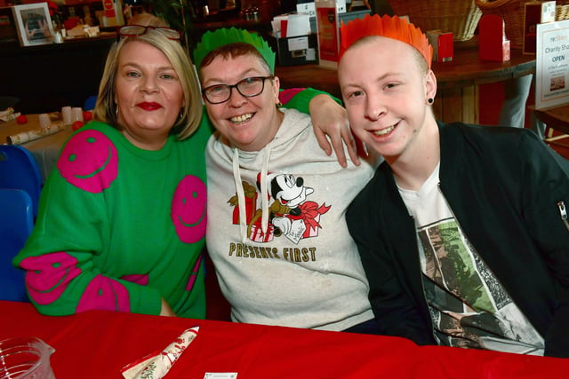Looking festive (from left) are Wendie Reeves, Wendy Bibb, and Daniel Dring
