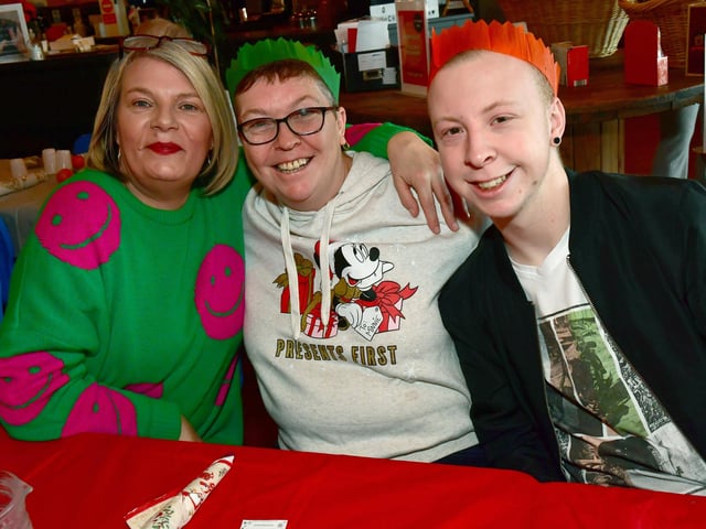 Looking festive (from left) are Wendie Reeves, Wendy Bibb, and Daniel Dring