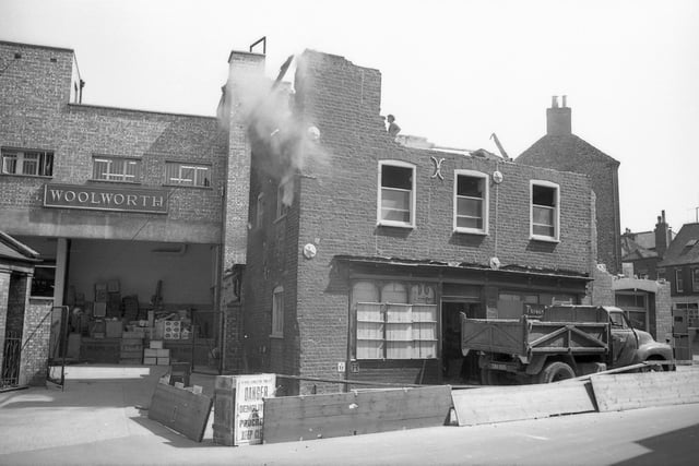Dust begins to fall to the rear of 'Woolworth'.