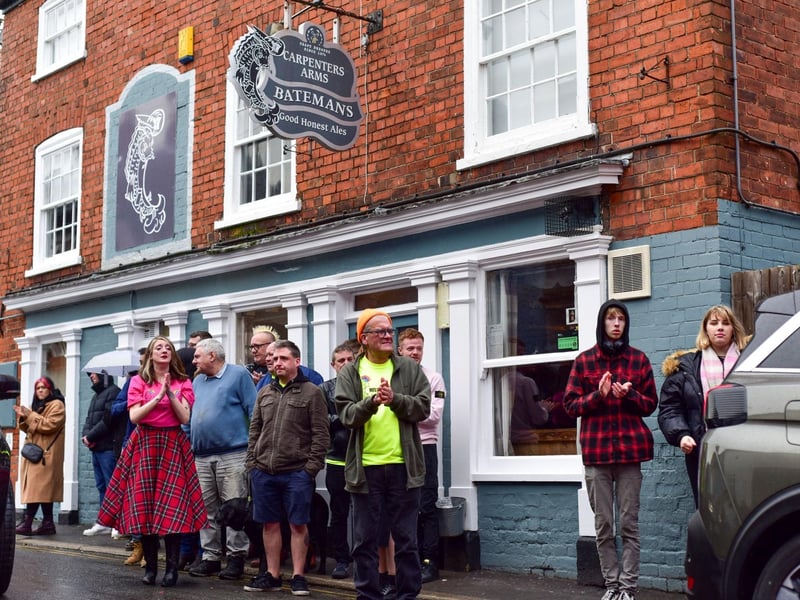 Friends outside the Carps pub, where Adi worked.