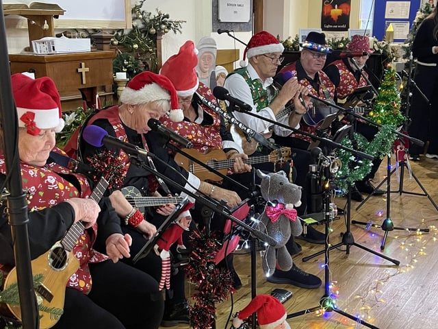 Creaking Bones Ukulele Band entertaining at the Wainfleet Community Meal.
