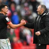 Lincoln City manager Michael Appleton congratulates Regan Poole after reaching the final of the League One play-offs.