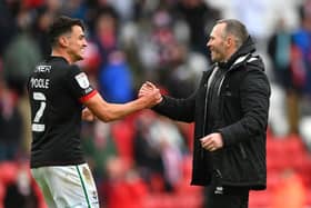 Lincoln City manager Michael Appleton congratulates Regan Poole after reaching the final of the League One play-offs.