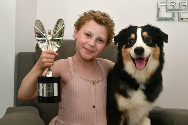 Freya Harris and Echo with her Pride of Britain Award Child of Courage award. Photos: D.R.Dawson Photography
