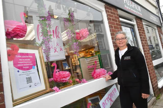 Samantha Brannick, company director of Colorgrafix with her pink window display. Photos: