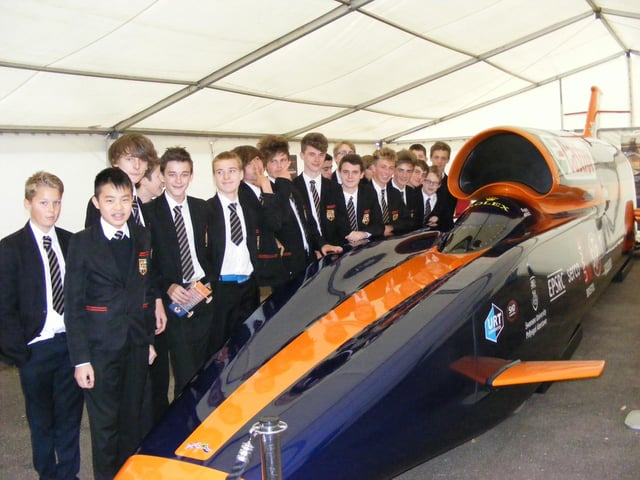 Year Nine pupils from Carre's Grammar School, Sleaford, alongside the Bloodhound supersonic car. Bloodhound SSC was on show at a manufacturing conference being held at the home of SHD Composite Materials, in Sleaford, which had been supplying resin for the vehicle's carbon fibre bodywork.