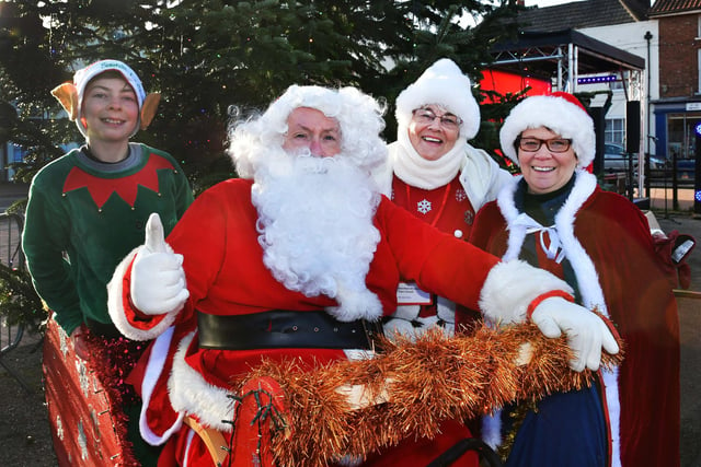 Santa and his little helpers (right) Couns Jean Hart and Wendy Bowket   in Wainfleet for the switch-on.