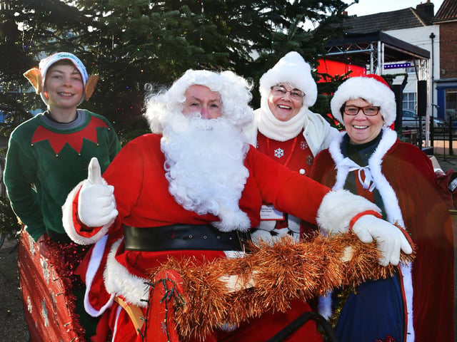 Santa and his little helpers (right) Couns Jean Hart and Wendy Bowket in Wainfleet for the switch-on.