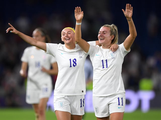 Chloe Kelly and Lauren Hemp celebrate following their side's huge victory.