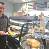 Coun Danny Brookes serving cake at his Indulgence Cafe in Skegness.