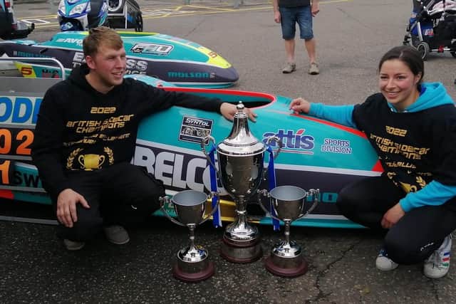 Todd Ellis and Emmanuelle Clement with their championship trophies. Photo: Dave Yeomans.