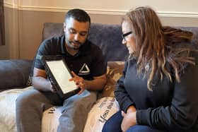 Green Doctor Fayad and Neena looking at online information to save money.
