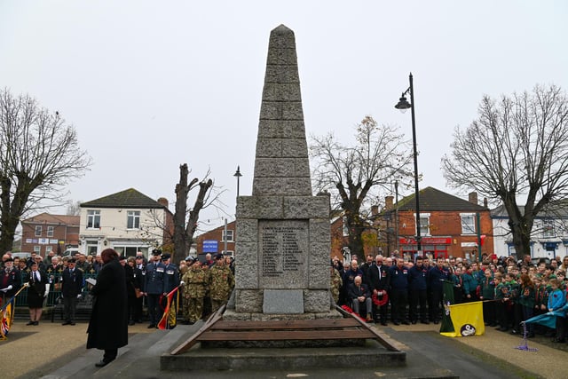 Members of the Kirton community gathered around the war memorial.