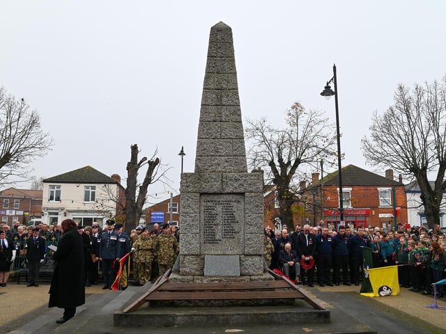 Members of the Kirton community gathered around the war memorial.