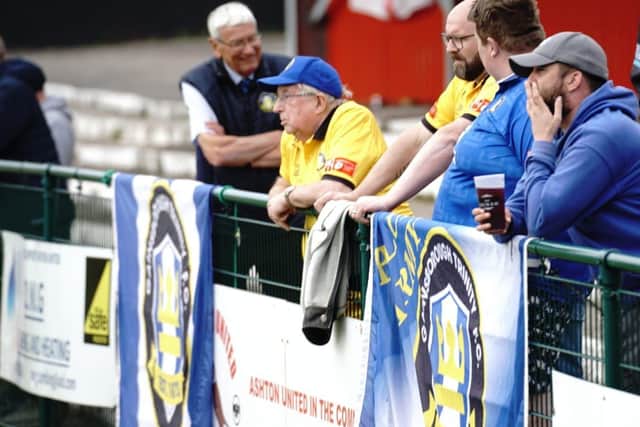 Trinity supporters in the sunshine at Ashton.