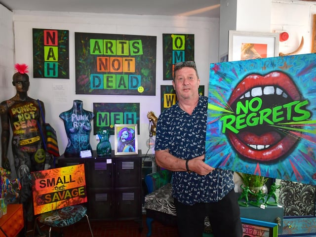 Stephen with art work by Samantha Woodward, at Corner of Creations. Photo: David Dawson