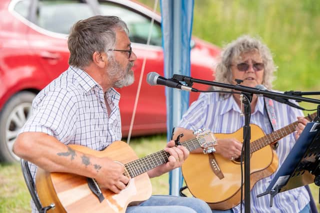 Guitar duo Nigel and Teri entertain the crowds.