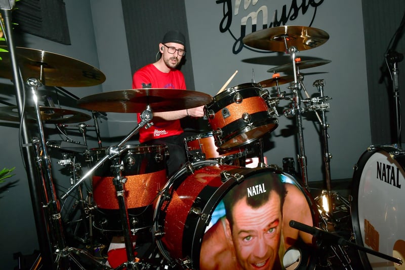 Ben Smith in action on a drum kit featuring an image from the film Die Hard.
