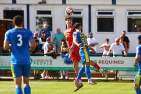 Action from Sleaford's (in red) game at Wellingborough. Photo: Steve W Davies Photography.