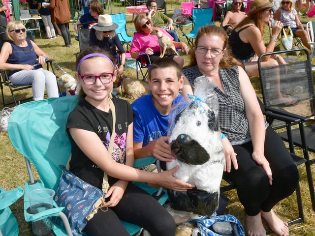 Jade Pearson, 11, Ryan Pearson, 15, and Sharon Garham with a prize won from one of the stalls.