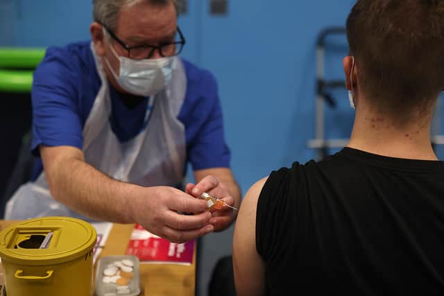 A student receives the Meningitis B vaccine. (Photo by Dan Kitwood/Getty Images)
