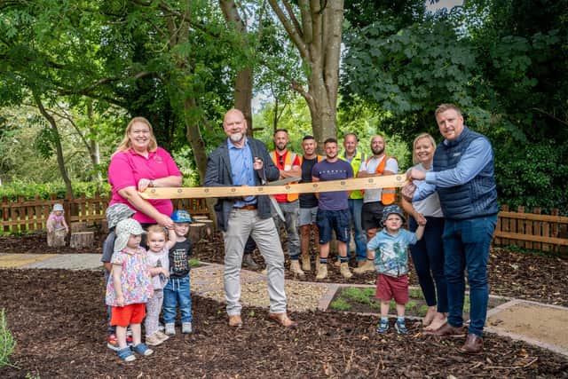Andy Richards of Allison Homes East cutting the ribbon to officially open the new garden