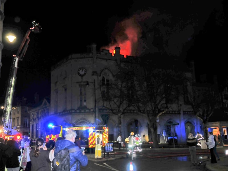 Firefighters and onlookers surround the burning sessions house in Sleaford. Photo: Roderick Carlyle