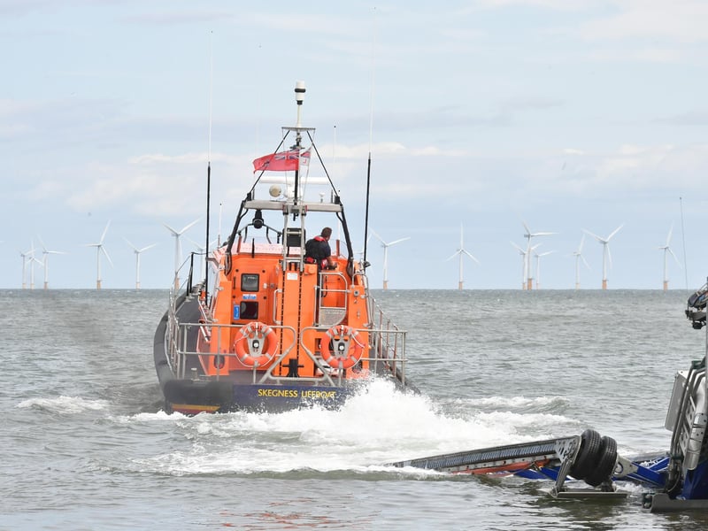 The lifeboat and RNLI volunteer crew head out to sea.