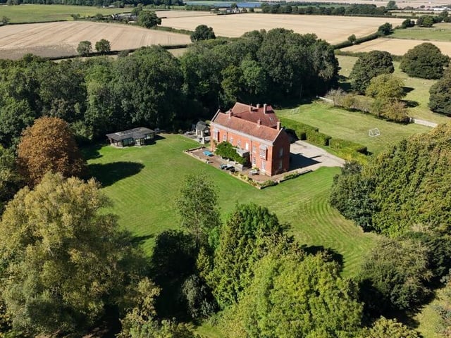Another aerial view of the home and its grounds.