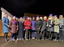Members of the Zero Degree Choir singing Christmas Carols in the School's playground.