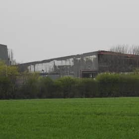 Fire damaged buildings at the Mid UK recycling plant.