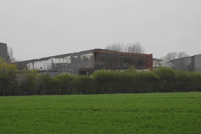 Fire damaged buildings at the Mid UK recycling plant.