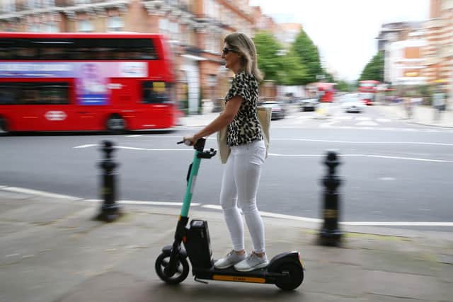An e-scooter user in London, where they can be ridden in public legally under a rental scheme. Image: Getty images