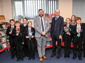 Principal Philip Dickinson, and CEO Martin Brown with pupils in the library. Photo by Jon Corken