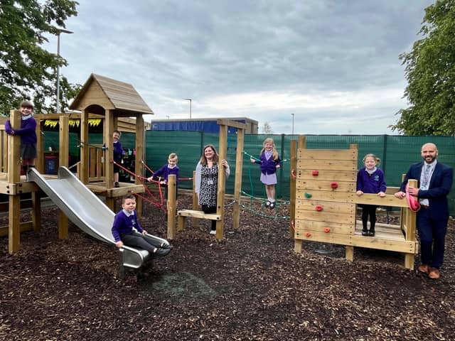 Horncastle Primary School's new EYF outdoor area. Pupils pictured with teacher Mrs Jess Withers and headteacher Mr Andrew Cook.