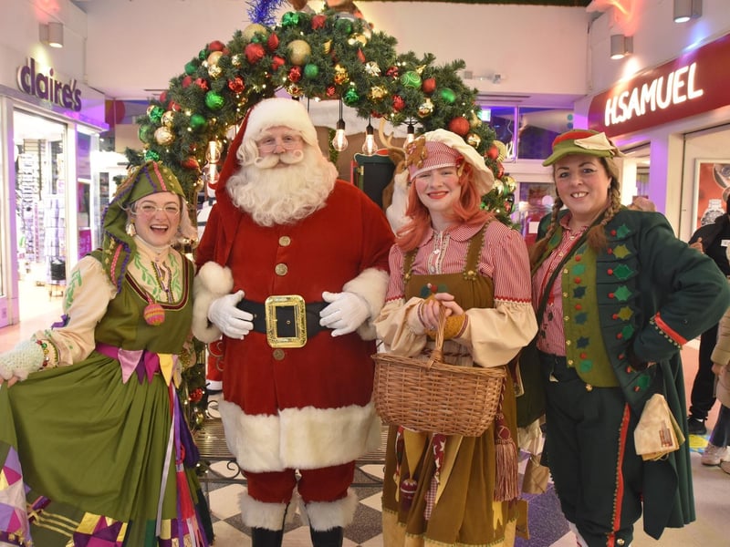 Santa with the Neverland Theatre elves.