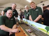 NG34 Model Railway Society members with their Shuntington model layout which they allowed visitors to play with and test their shunting skills. L-R Eddie King - treasurer, Shaun Gill - chairman, Colin Houseman - secretary, James King - exhibition manager.