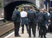 Schoolchildren awaiting the arrival of a Northern service.