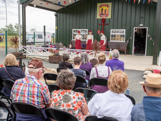 Visitors to the museum watching the performance by Blighty Belles'