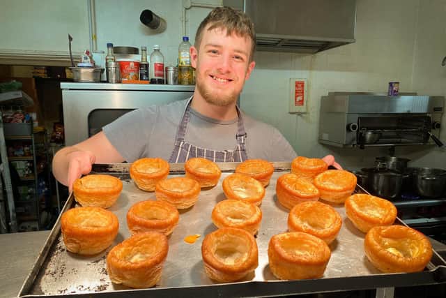 Ben Hugill serving Yorkshire Puddings.