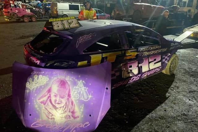 The image of Gracie-Mae on the banger car driven by her dad, Jordon.