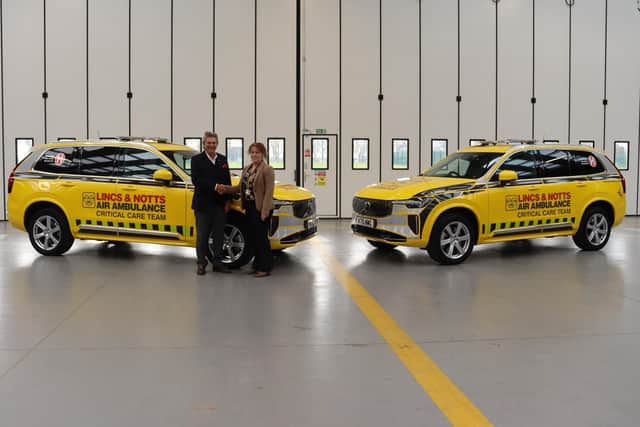 Robert Bertram, Chief Executive of the HELP Appeal, presenting the two new critical care cars to LNAA CEO Karen Jobling.
